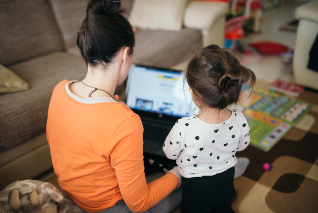 Mother and young daughter look at a laptop. 
Photo credit: nenadstojkovic (Flickr) 